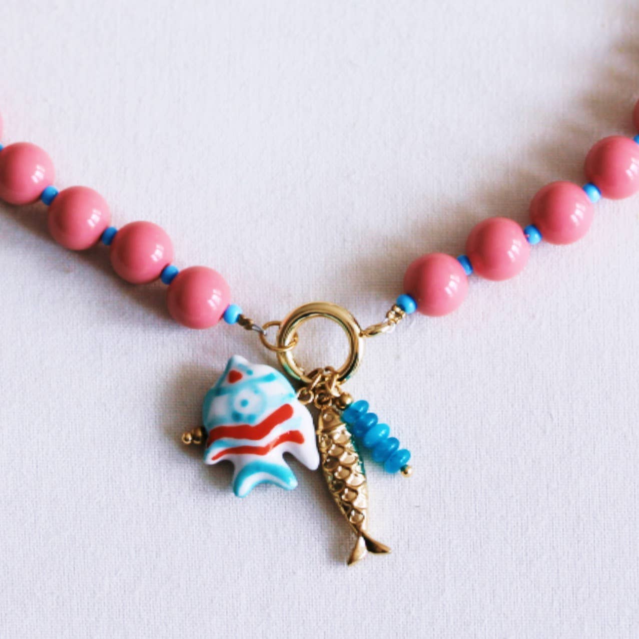 Beaded necklace with Miyuki beads with charms - coral/blue